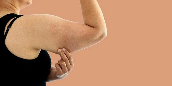 Toning Bingo Wings: Your Ultimate Guide to Sculpting Sleek Arms at the Gym 1 Woman doing push-ups for arm strength Deal